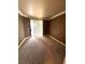 Bedroom with neutral carpet and trim; sliding glass door provides access to a balcony at 270 E Flamingo Rd # 214, Las Vegas, NV 89169