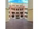 Elegant building courtyard with unique architecture and a manicured green area at 270 E Flamingo Rd # 214, Las Vegas, NV 89169