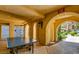 Game room features a ping pong table and arched passageway to the community at 270 E Flamingo Rd # 214, Las Vegas, NV 89169