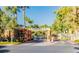 Community gate entrance with well-maintained landscaping and secure access for residents at 270 E Flamingo Rd # 214, Las Vegas, NV 89169