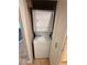 Compact, stacked washer and dryer unit efficiently fitted in a closet space, ready for laundry needs at 270 E Flamingo Rd # 214, Las Vegas, NV 89169