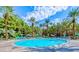 Resort style community pool with ample seating and mature landscaping at 270 E Flamingo Rd # 214, Las Vegas, NV 89169