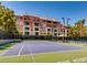 Community tennis court surrounded by lush greenery, perfect for active living and recreational enjoyment at 270 E Flamingo Rd # 214, Las Vegas, NV 89169