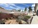 Well kept backyard, featuring an outdoor dining area and garden at 2701 Brookstone Ct, Las Vegas, NV 89117