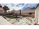Expansive backyard featuring a combination of rock and artificial turf at 2701 Brookstone Ct, Las Vegas, NV 89117