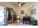 Bright dining room with a modern table set, stylish decor, and a glass door with access to backyard at 2701 Brookstone Ct, Las Vegas, NV 89117