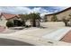Exterior view of the home with a lengthy drive way at 2701 Brookstone Ct, Las Vegas, NV 89117