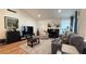 Cozy living room with a brick fireplace, plush seating, vaulted ceiling, and ample natural light at 2701 Brookstone Ct, Las Vegas, NV 89117