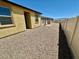 Low-maintenance backyard with gravel, surrounded by fencing, offering privacy and simple outdoor space at 2707 Chinaberry Hill St, Laughlin, NV 89029