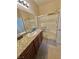 Bathroom featuring granite countertops, modern fixtures, and a glass-enclosed shower at 2707 Chinaberry Hill St, Laughlin, NV 89029