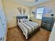 Charming bedroom featuring stylish decor, a comfortable bed, and a window providing natural light at 2707 Chinaberry Hill St, Laughlin, NV 89029