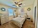 Bedroom with neutral decor, ceiling fan, and plenty of natural light at 2707 Chinaberry Hill St, Laughlin, NV 89029