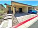 Inviting single-story home featuring a covered parking area and landscaped entrance at 2707 Chinaberry Hill St, Laughlin, NV 89029