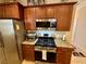 Updated kitchen with stainless steel appliances, granite countertops, and wood cabinets at 2707 Chinaberry Hill St, Laughlin, NV 89029