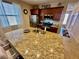 Granite kitchen island with stainless steel appliances at 2707 Chinaberry Hill St, Laughlin, NV 89029