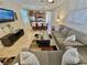 Spacious living area with a view of the kitchen and seating at the granite-topped island at 2707 Chinaberry Hill St, Laughlin, NV 89029