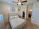 Comfortable bedroom with ceiling fan, and ensuite bath at 2707 Chinaberry Hill St, Laughlin, NV 89029