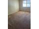 Carpeted bedroom with neutral paint and natural light from a window at 2713 Otter Creek Ct # 202, Las Vegas, NV 89117