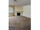 Neutral living room with carpet, a stone fireplace, and a large window at 2713 Otter Creek Ct # 202, Las Vegas, NV 89117