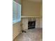 Neutral living room with carpet, a stone fireplace, and a large window at 2713 Otter Creek Ct # 202, Las Vegas, NV 89117