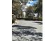 Street featuring mature trees and single story condo buildings at 2713 Otter Creek Ct # 202, Las Vegas, NV 89117