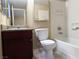Cozy bathroom with a vanity featuring granite countertops, modern fixtures, and a shower-tub combo at 2750 S Durango Dr # 1038, Las Vegas, NV 89117