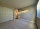 Neutral bedroom featuring carpet, a double closet with sliding doors, and natural light at 2750 S Durango Dr # 1038, Las Vegas, NV 89117