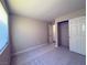 Cozy bedroom with neutral carpeting, closet, and ample natural light from the window at 2750 S Durango Dr # 1038, Las Vegas, NV 89117