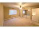 Spacious bedroom with plush carpet, ceiling fan, and sliding mirror closet doors at 2750 S Durango Dr # 1038, Las Vegas, NV 89117