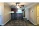 A dining area featuring unique tile floors, a ceiling fan, and a view of the kitchen bar at 2750 S Durango Dr # 1038, Las Vegas, NV 89117