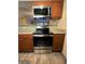 A well-equipped kitchen with stainless steel oven and microwave paired with granite countertops at 2750 S Durango Dr # 1038, Las Vegas, NV 89117