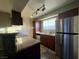 A modern kitchen with stainless steel appliances, granite countertops, and ample cabinet space at 2750 S Durango Dr # 1038, Las Vegas, NV 89117