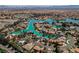 Gorgeous aerial view of lakeside homes in a beautiful planned community with lush landscaping and lake access at 2805 High Sail Ct, Las Vegas, NV 89117
