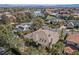 Expansive aerial view showcasing a stunning single-story house, lush greenery, and a private pool at 2805 High Sail Ct, Las Vegas, NV 89117