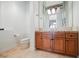 Bathroom featuring custom vanity, granite countertop, and updated fixtures at 2805 High Sail Ct, Las Vegas, NV 89117