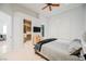 Bright bedroom features a walk-in closet and is equipped with a wall-mounted TV for convenient viewing at 2805 High Sail Ct, Las Vegas, NV 89117