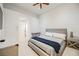 Bright bedroom with modern furniture and a comfortable bed dressed with gray and blue blanket at 2805 High Sail Ct, Las Vegas, NV 89117