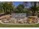 Welcoming entrance to Lakes Estates, featuring lush landscaping and a community sign at 2805 High Sail Ct, Las Vegas, NV 89117