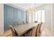Dining room featuring a modern chandelier, detailed paneling and formal setting at 2805 High Sail Ct, Las Vegas, NV 89117
