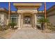 Inviting front entrance featuring desert landscaping and a beautiful double door entryway at 2805 High Sail Ct, Las Vegas, NV 89117