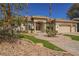 Lovely single Gathering home featuring desert landscaping, circular driveway and a three-car garage at 2805 High Sail Ct, Las Vegas, NV 89117