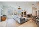 Open-concept living area featuring custom wet bar, entertainment center, and tiled floors at 2805 High Sail Ct, Las Vegas, NV 89117