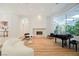 Inviting living room featuring travertine floors, fireplace, and sunlit atrium at 2805 High Sail Ct, Las Vegas, NV 89117