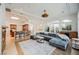 Open living area with comfortable seating, bar, and seamless flow to the adjacent kitchen at 2805 High Sail Ct, Las Vegas, NV 89117