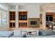 Inviting living room featuring built-in shelving, fireplace, and comfortable seating area at 2805 High Sail Ct, Las Vegas, NV 89117