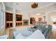 Spacious living room with fireplace, built-in cabinets and barstool seating at the kitchen counter at 2805 High Sail Ct, Las Vegas, NV 89117