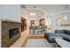 Seamless floorplan that integrates the living room, breakfast bar, and fireplace at 2805 High Sail Ct, Las Vegas, NV 89117