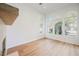 Bright living room featuring hardwood floors and arched windows offering beautiful views at 2805 High Sail Ct, Las Vegas, NV 89117