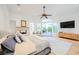 Large main bedroom with fireplace, seating area, and access to an outdoor patio at 2805 High Sail Ct, Las Vegas, NV 89117