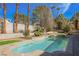 Up close detailed view of the pool and spa with mature trees surrounding the backyard at 2805 High Sail Ct, Las Vegas, NV 89117
